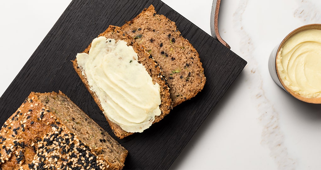Seedy bread slice slathered with vegan miso butter
