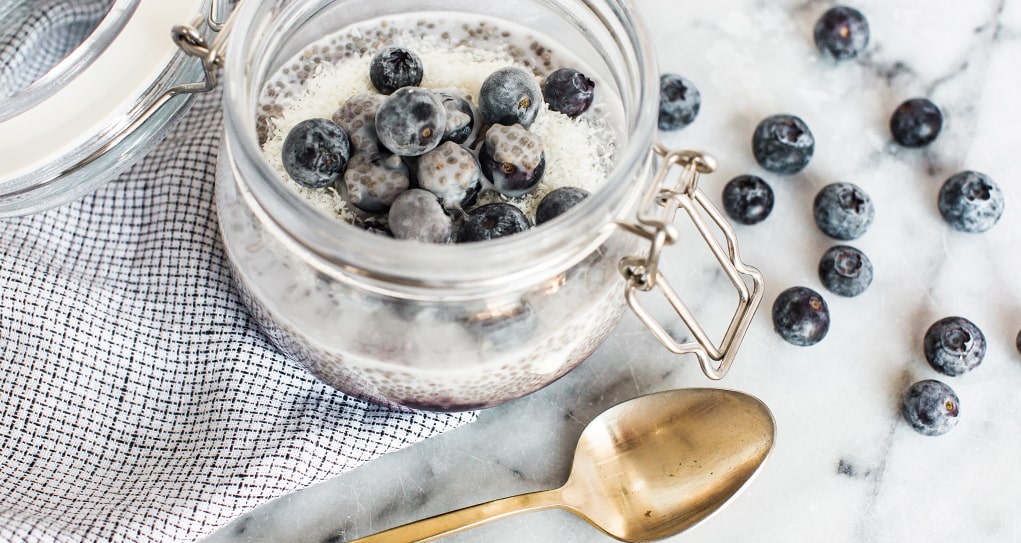 blueberry chia pudding in an 8oz mason jar with a lock lid