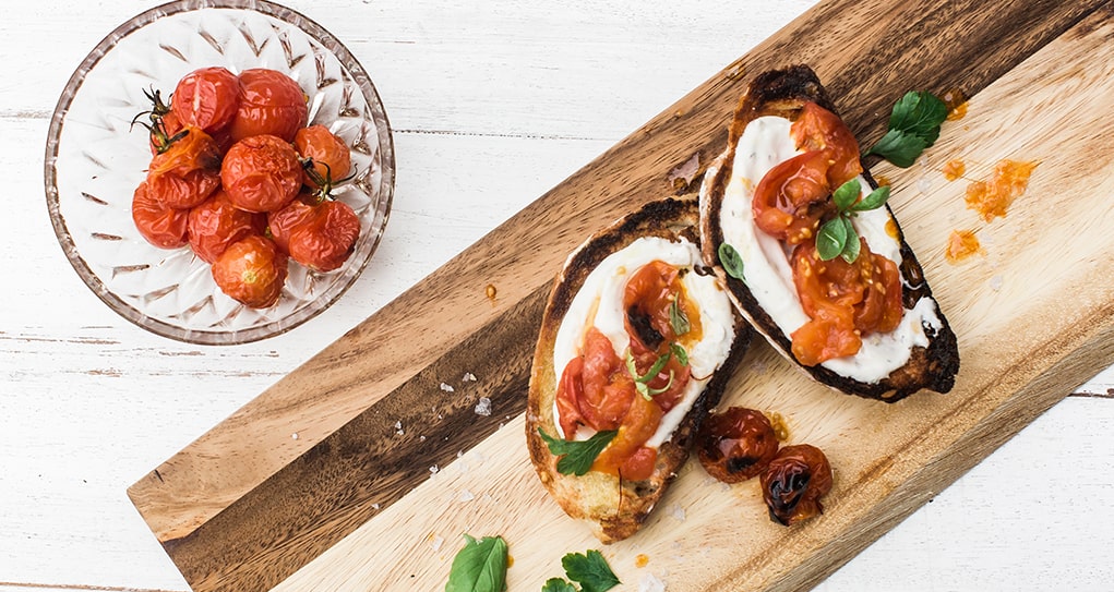 Caprese inspired bruschetta with Creamy spread and smashed roasted tomatoes