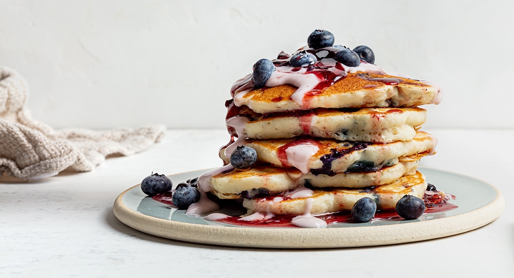Triple Blueberry Pancakes with Vegan Yogurt Drizzle