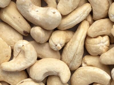 Close up photo of raw cashews.