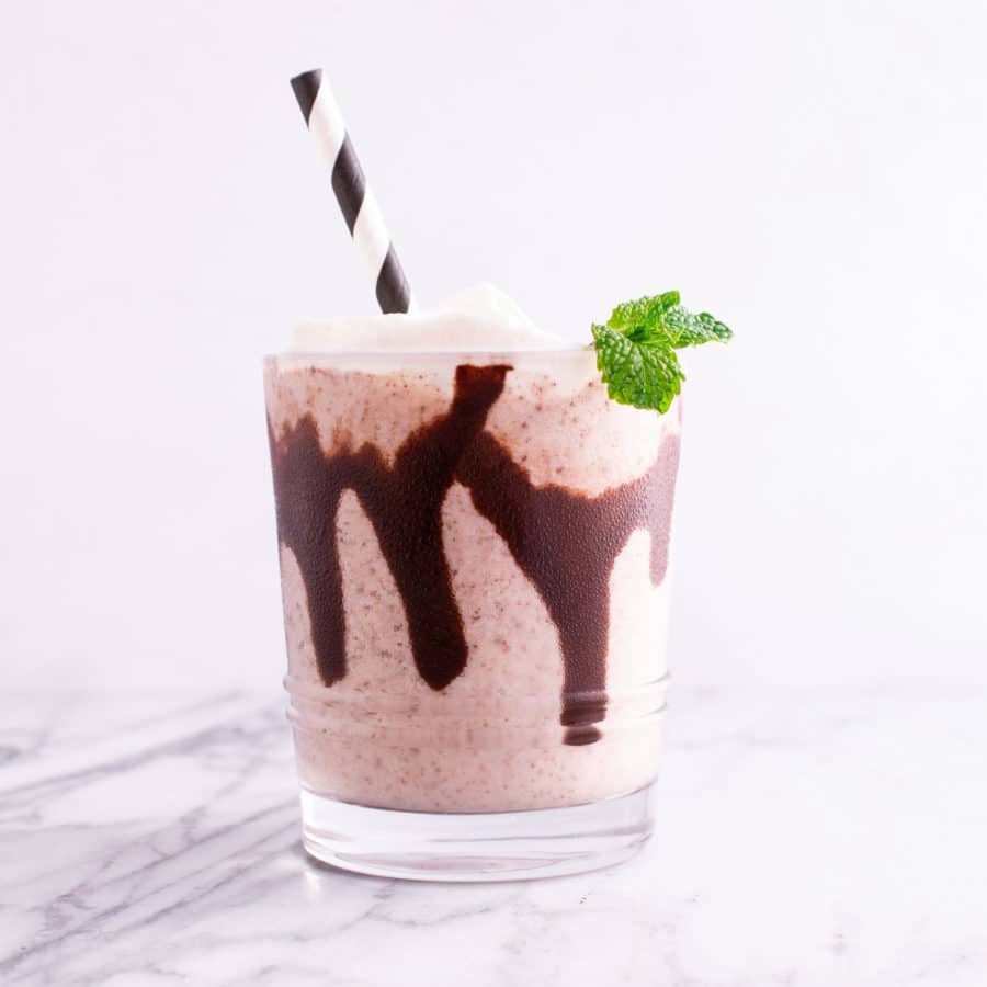 A Glass of Mint Chip Milkshake with Chocolate Drizzle