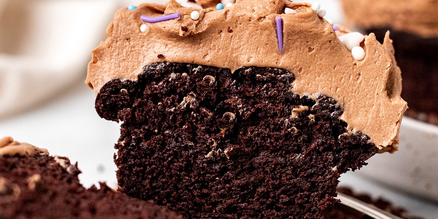Close up of a chocolate cupcake cut in half.