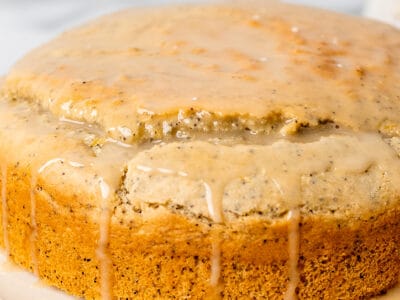 Lemon Poppyseed cake drizzled with golden vegan honey vanilla glaze.