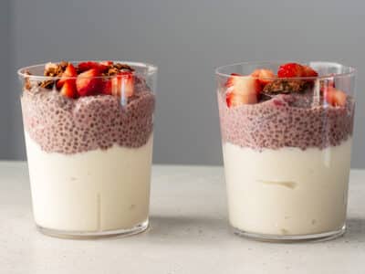 Two glass cups filler with berry chia pudding.